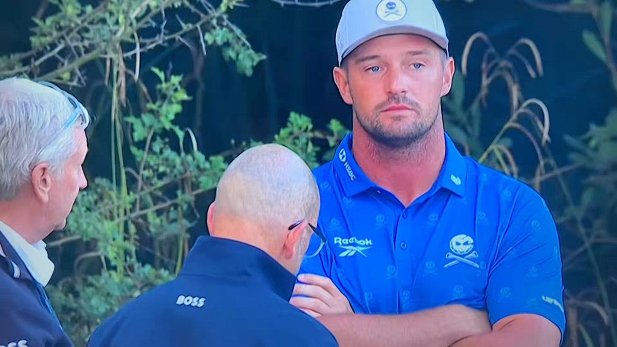 During his exchange with the rules official at the 5th hole, Bryson DeChambeau appeared to threaten not to play tomorrow. 

When walking back into scoring a reporter asked if he is playing tomorrow. 

He said nothing, smiled, and kept walking into scoring. 