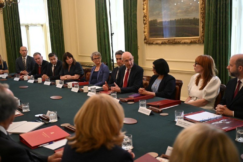 UK's Andy Burnham kicks off his first cabinet meeting. 