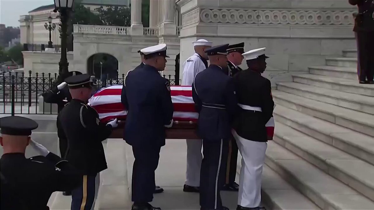 U.S. military personnel carried the casket of Senator Lindsey Graham into the Capitol Rotunda, where his sister, Darleen Graham Nordone, received it. 