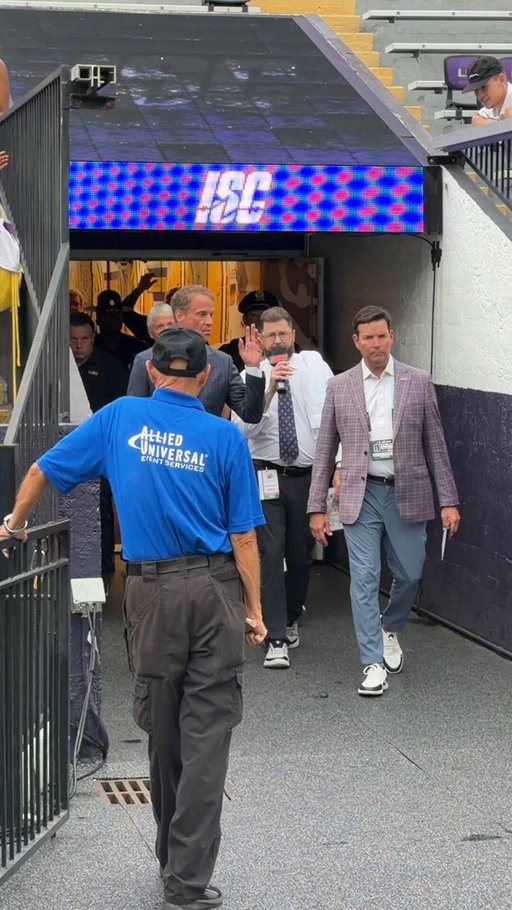 Lane Kiffin walks out in Tiger Stadium for the first time on game day 