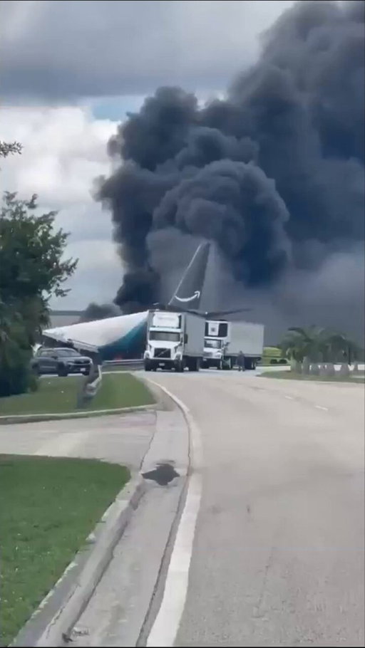 An Amazon cargo plane has crash landed at Miami International Airport after overshooting the runway and hitting a nearby road.

