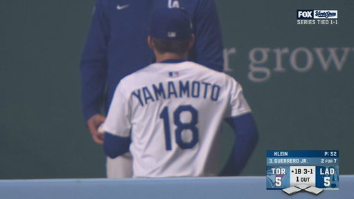 Yoshinobu Yamamoto warming up in the 18th inning of Game 3 of the World Series after pitching a Complete Game in Game 2 of the World Series 