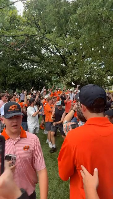 THE OKLAHOMA STATE FIELD GOAL POSTS ARE IN THE WATER 