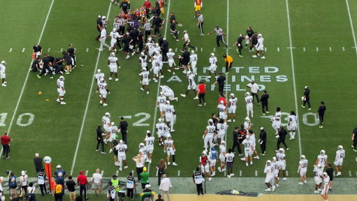The scene following the late hit to Dante Moore 