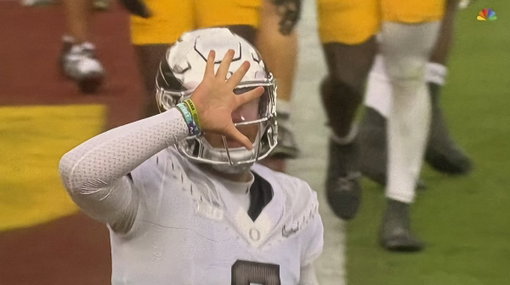Oregon QB Dylan Raiola threw up a "5" after his touchdown pass for Dante Moore following his injury against USC. 