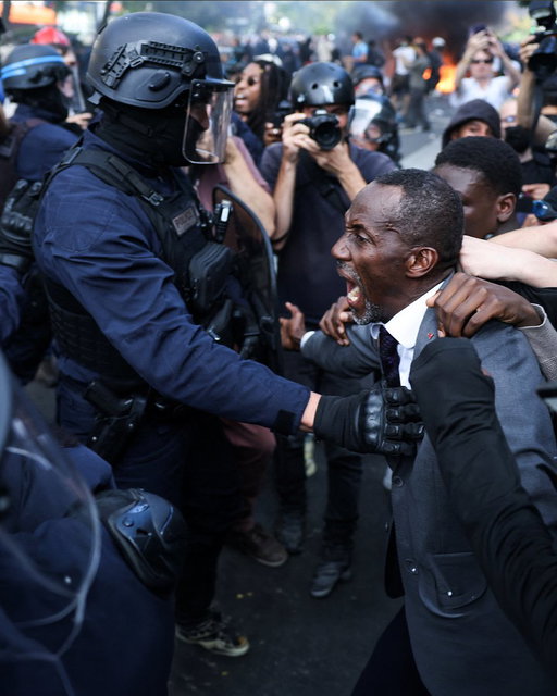 A French mayor was tear-gassed while shielding protesters.

Saint-Denis Mayor Bally Bagayoko was hit with tear gas after stepping between student demonstrators and riot police during protests in Paris and Lyon over funding for French high schools. 