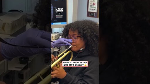Looking inside throat while playing a trumpet