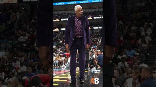Julius Erving rocking a purple velvet suit with a gold Ferragamo suit at the 'BIG3'