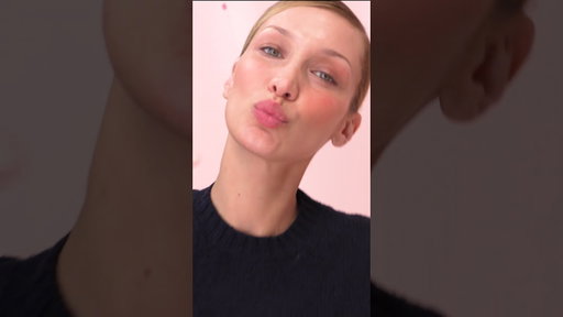 A kiss from Bella Hadid, straight from the Prada Touch set. #PradaBeauty #PradaMakeup #PradaPeople