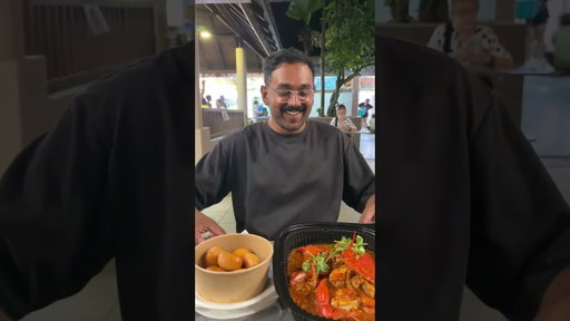 Eating at East Coast Lagoon, Singapore.
