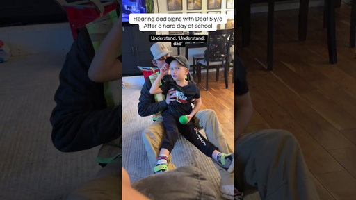 Hearing dad signs w Deaf son after a hard day #cochlearimplant #signlanguage #deaf #asl #parenting