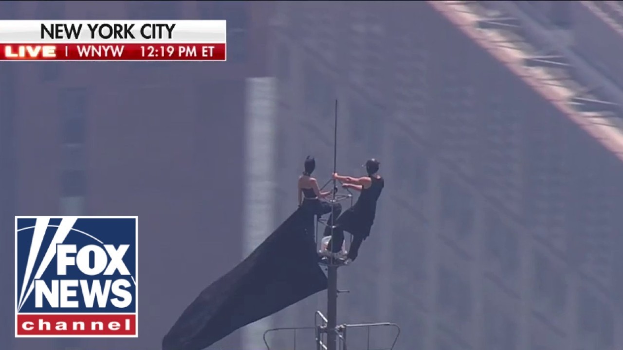 BREAKING: Protesters CLIMB Empire State Building spire
