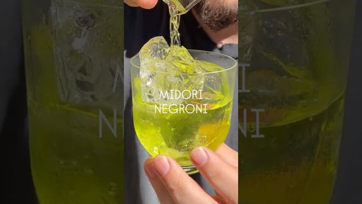 GREEN NEGRONI - A Midori Negroni made for a 70s themed bar in Vegas.