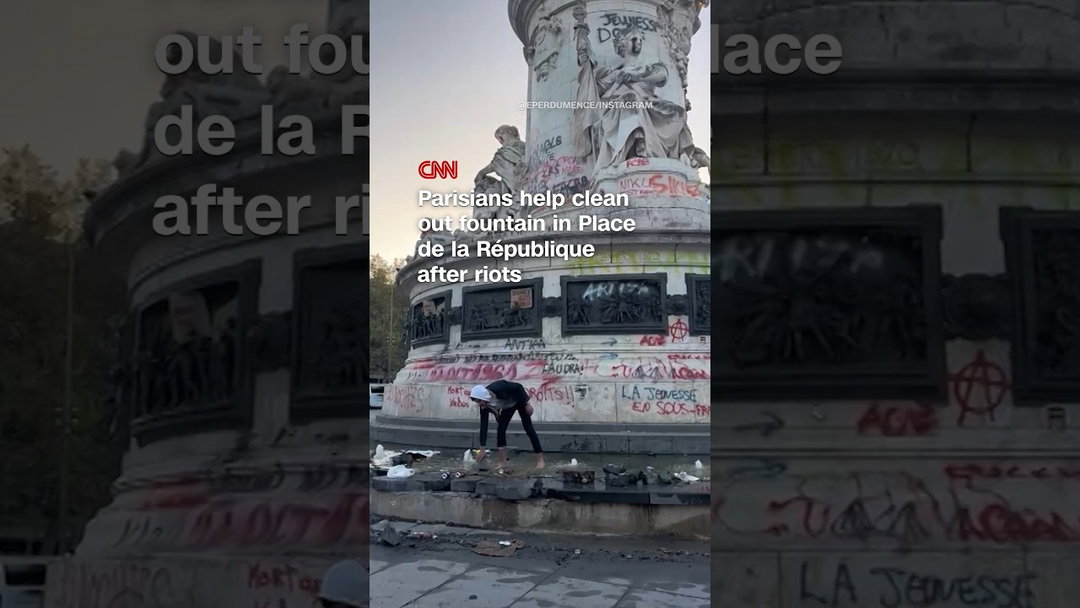 Parisians help clean out fountain in Place de la République after riots