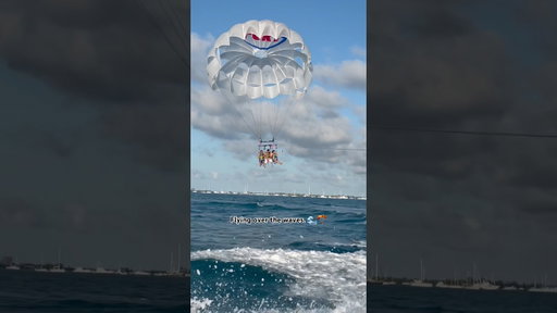 Flying over the waves. 🌊🪂  #SummerOfGoals #parasailing #miami #activities
