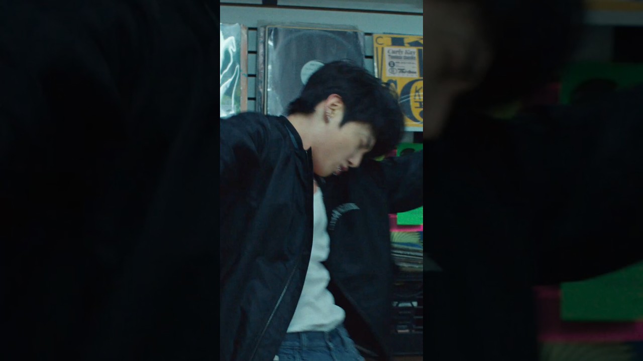 Jung Kook channels classic rock energy. All about the graphic bomber and 90s Straight Jeans.