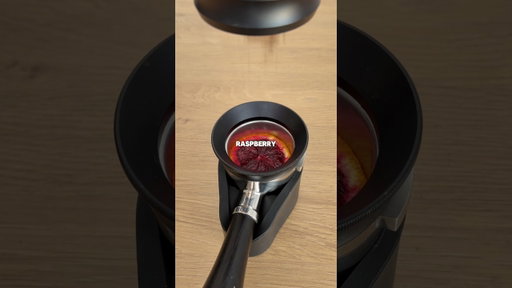 Pulling a shot of espresso through a raspberry orange
