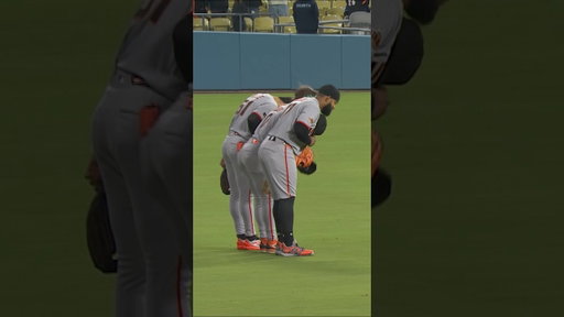 A bow from the outfielders after winning game two against the Dodgers