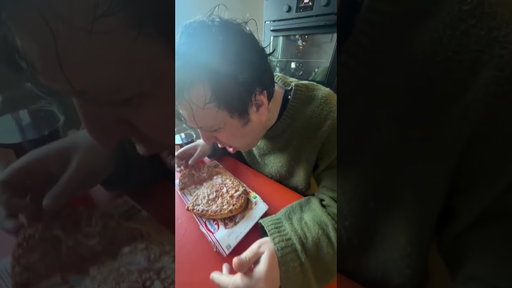 Jim E. Brown consuming Tuna Pizza