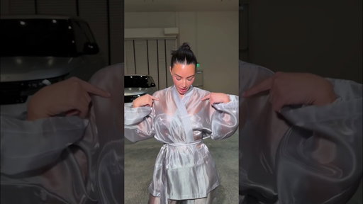 Kim Kardashian wears SKIMS Liquid Organza Wrap Sleep Set.