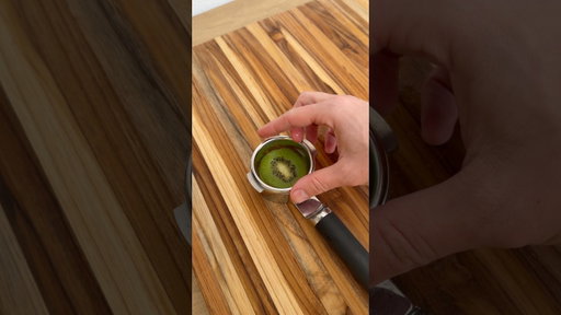 Pulling a shot of espresso through a kiwi